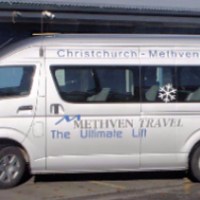 a car parked in front of a bus